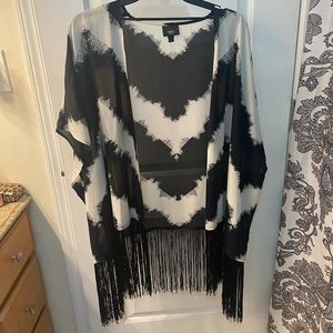 Black and white sheer oversized poncho with fringed bottom
